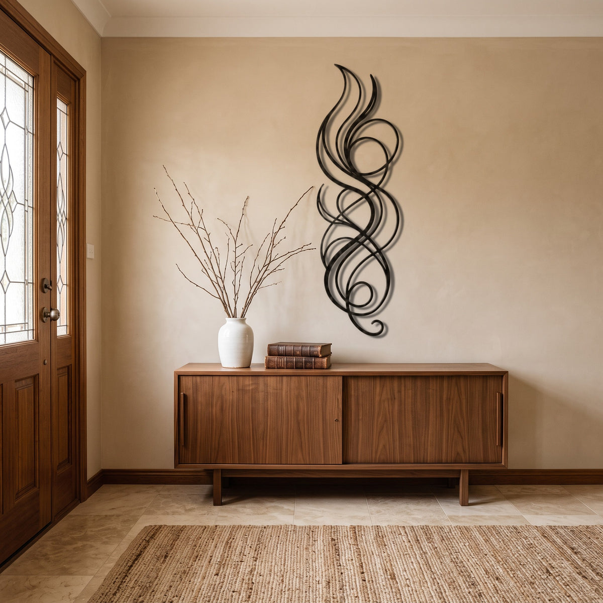 Abstract Flame Swirl Vertical Metal Wall Art above a walnut console in an entrance hall