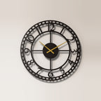 Vintage Station Numerals Metal Wall Clock on a plain wall, laser-cut steel