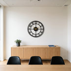 Vintage Station Numerals Metal Wall Clock in a modern office